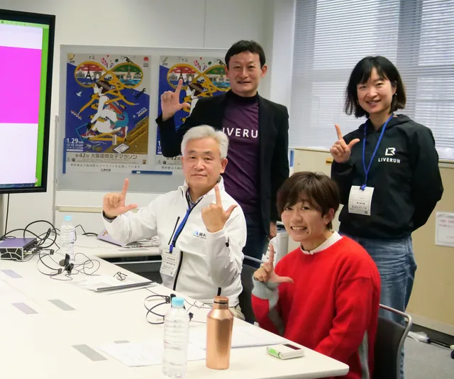 A LIVERUN session photograph marking Mizuki Noguchi's guest appearance — Athens Olympic Marathon gold medalist — pictured with members of the LIVERUN team